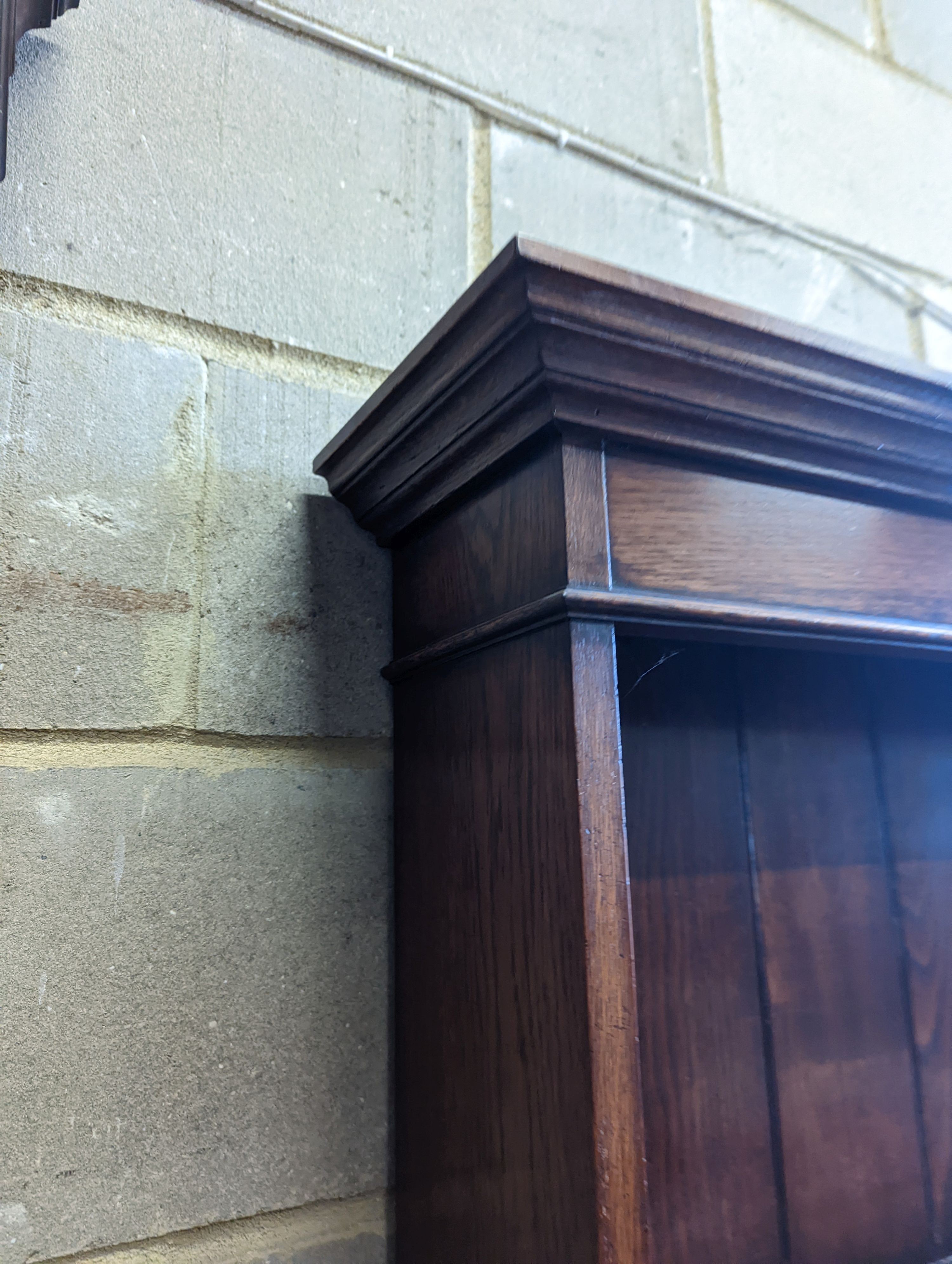 An 18th century style oak dresser with boarded plate rack, width 199cm, depth 48cm, height 198cm